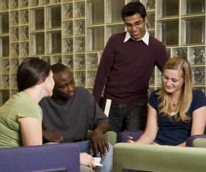 Four young adults studying together